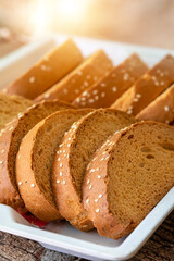 Crispy rusk, Biscuits cake rusk over wooden background , a crunchy snack infused with traditional spices, perfect for tea or coffee. A delightful treat for your mornings or tea time