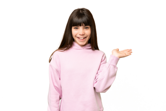 Little girl over isolated green chroma key background holding copyspace imaginary on the palm to insert an ad
