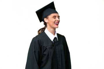 Young university graduate  caucasian woman over isolated background laughing in lateral position