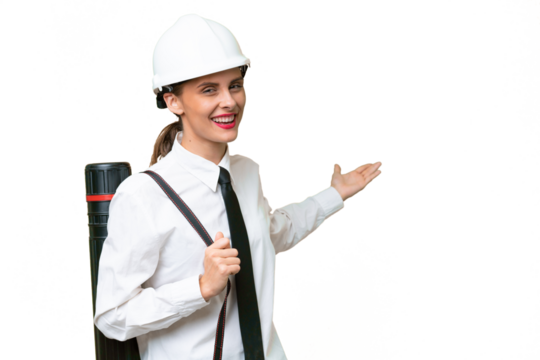 Young architect woman with helmet and holding blueprints over isolated background extending hands to the side for inviting to come