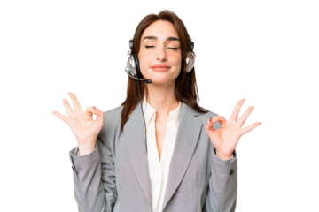 Telemarketer caucasian woman working with a headset over isolated chroma key background in zen pose