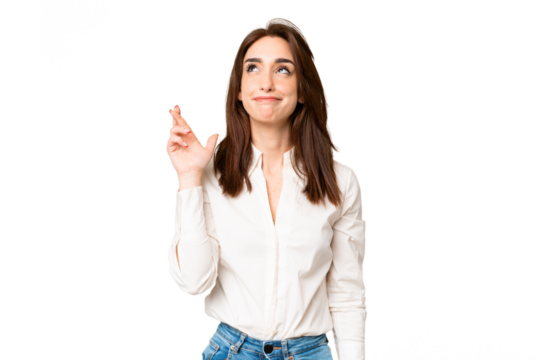 Young caucasian woman over isolated chroma key background with fingers crossing and wishing the best