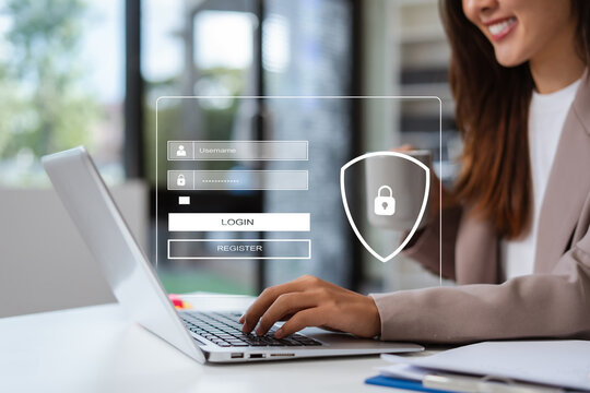 Businesswoman typing login and password in the concept of cyber security, information security, data protection, and encryption for secure access to user's personal information.