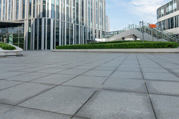 empty road in front of modern office building in the city
