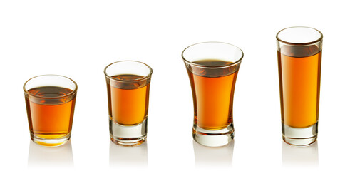 set of shot glasses with tequila or liqueur isolated on white background