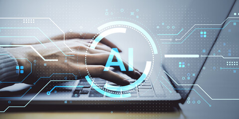 Person typing on laptop with AI digital interface overlay on futuristic technology background for artificial intelligence concept.