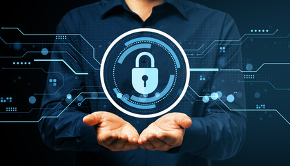 Businessperson showing digital padlock icon with hands representing cybersecurity and data protection on dark technology background.