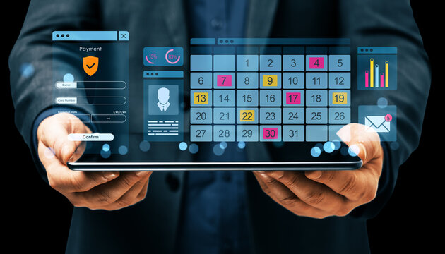 Businessman holding tablet with floating digital calendar, payment form, and analytics interface on dark background with abstract light effects. - Powered by Adobe