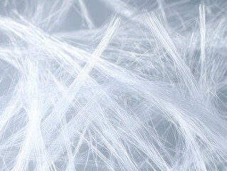 Coarse filament fibers illuminated by soft natural light create intricate and delicate texture with translucent and airy appearance, evoking sense of lightness and fragility