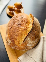  freshly baked sourdough bread with a textured, golden crust.