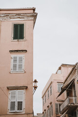 Architecture of Pink Buildings with Shuttered Windows