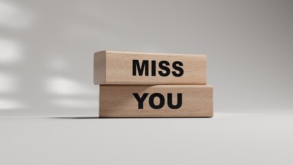 Miss you. Concept word Miss you on wooden blocks.Business and Miss you concept. Copy space.3D rendering on white background.