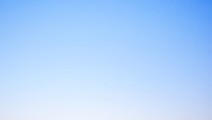 A beautiful gradient blue sky offers a sense of tranquility and serenity, Perfect for creating an atmosphere of peace, freedom and limitless possibilities.