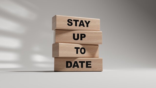 Text STAY UP TO DATE writing in wooden blocks. Business concept. wooden blocks. Copy space.3D rendering on white background.