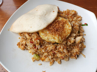 Indonesian Nasi Goreng (Fried Rice) with Fried Egg and Kerupuk Crackers