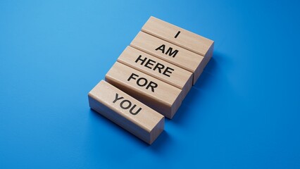 I am here for you symbol. Concept words I am here for you on wooden blocks.Business and I am here for you concept. Copy space.3D rendering on blue background.