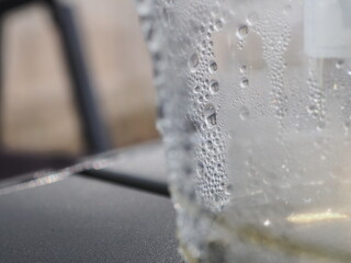 Water drops on a plastic coffee cup