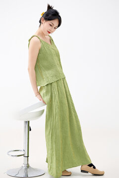 Studio shot of a beautiful woman wearing a Chinese dress for a summer trip