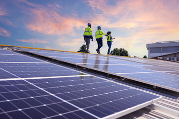 A team of engineers is laying out the installation of an outdoor solar panel system. Installing...