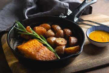 Baked fish with potatoes and rosemary
