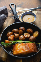 Baked fish with potatoes and rosemary