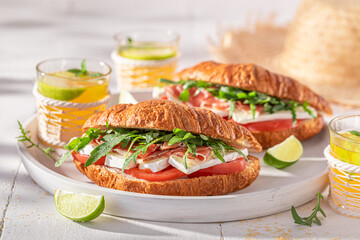 Delicious french croissant made of cheese, ham and vegetables.