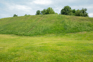 A big green hill on a summer day