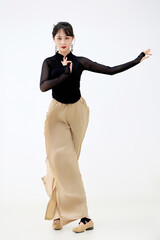 Attractive dancer performing Chinese classical dance on white background