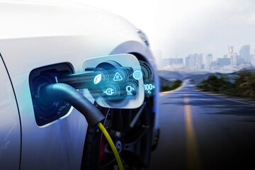 Power cable pump plug in charging power to electric vehicle EV car.