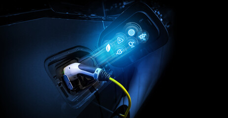 Power cable pump plug in charging power to electric vehicle EV car.