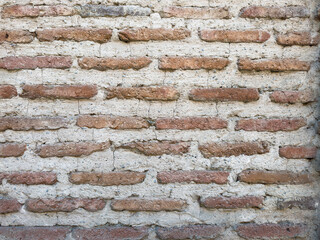 A high-resolution image of a rustic red brick wall . High quality photo