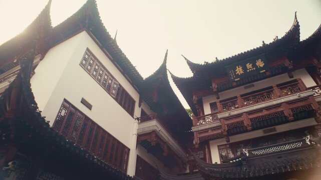 Afternoon Walk in Old Shanghai &ndash; Traditional Chinese architecture frames crowds exploring Yuyuan&rsquo;s vibrant streets.