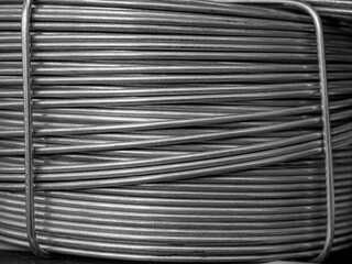 Metal wire coils stacked neatly ready for construction and crafting projects in a workshop...