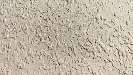 Naklejka premium Textured white wall surface featuring decorative plaster patterns with subtle depth and interest