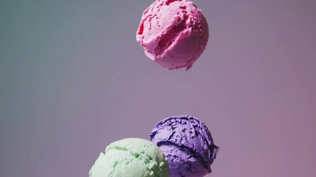 Colorful scoops of ice cream floating against a pastel background creating a delightful visual treat