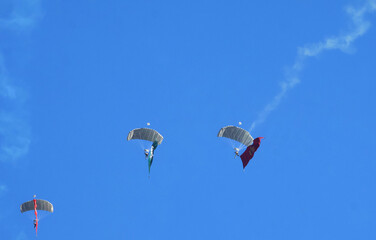 Paratroopers land in an air show to mark Jordan's Independence Day.