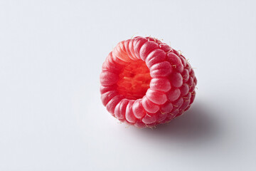 Isolated raspberry on white. Fresh, vibrant, and detailed, evokes health, sweetness, and summer. Ideal for food blogs, recipes, healthy eating, and product showcases.