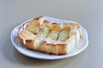 toast or bread with butter topping , toast bread or sliced bread