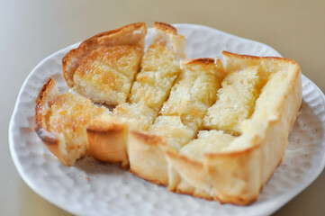 toast or bread with butter topping , toast bread or sliced bread
