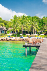 Beautiful tropical beach at exotic island with palm trees