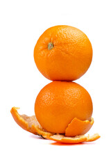 A stack of two fresh, ripe and sweet oranges underneath decorated with orange peel, perfect for illustration of nutrition, vitamin C, natural food and healthy lifestyle.
