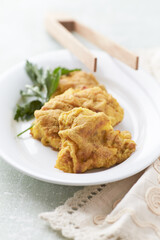 Pork Schnitzel on wooden background. Close up.