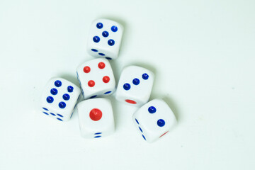 A close up photo of dices, top view isolated on white background