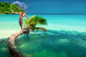 Beautiful tropical beach with travel people enjoying summer vacation in tropical paradise