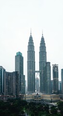 Fototapeta premium Majestic Cityscape Photo featuring Kuala Lumpur Petronas Towers