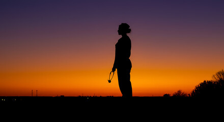 Silhouette of a Woman at Sunset A Moment of Reflection and Tranquility