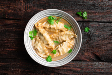Wonton soup. Asian dumpling soup.
