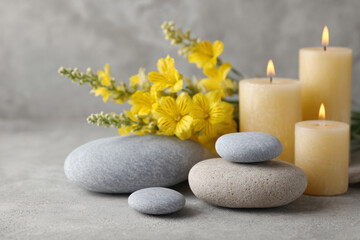 a bunch of rocks and candles on a table