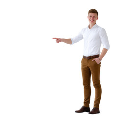 A young man in a white shirt and brown pants stands smiling, pointing to the right against a white background, ideal for promotional or advertising purposes.