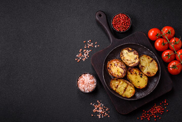 Food, potatoes cut in halves or slices grilled. Cooked baked potatoes